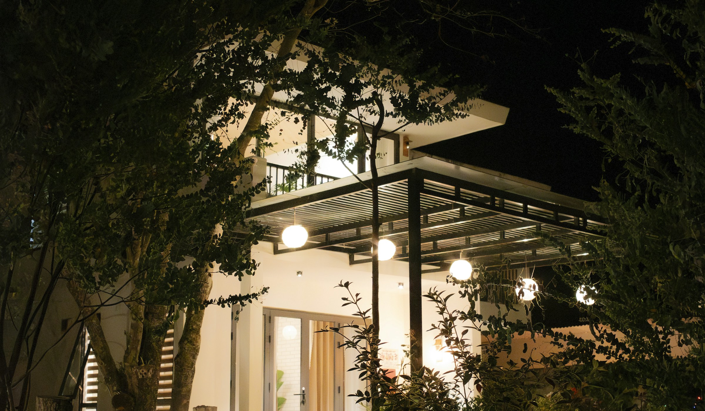 Modern home with outdoor lighting at night